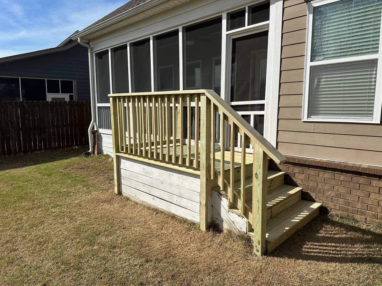 Completed pressure-treated landing and stair run at a back entry in Chattanooga, TN